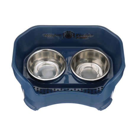 Photo showing drainage holes in a dark blue medium neater feeder top view with two stainless steel bowls against a white background.