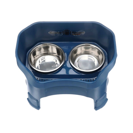 Photo showing drainage holes in a dark blue large neater feeder top view with two stainless steel bowls against a white background.