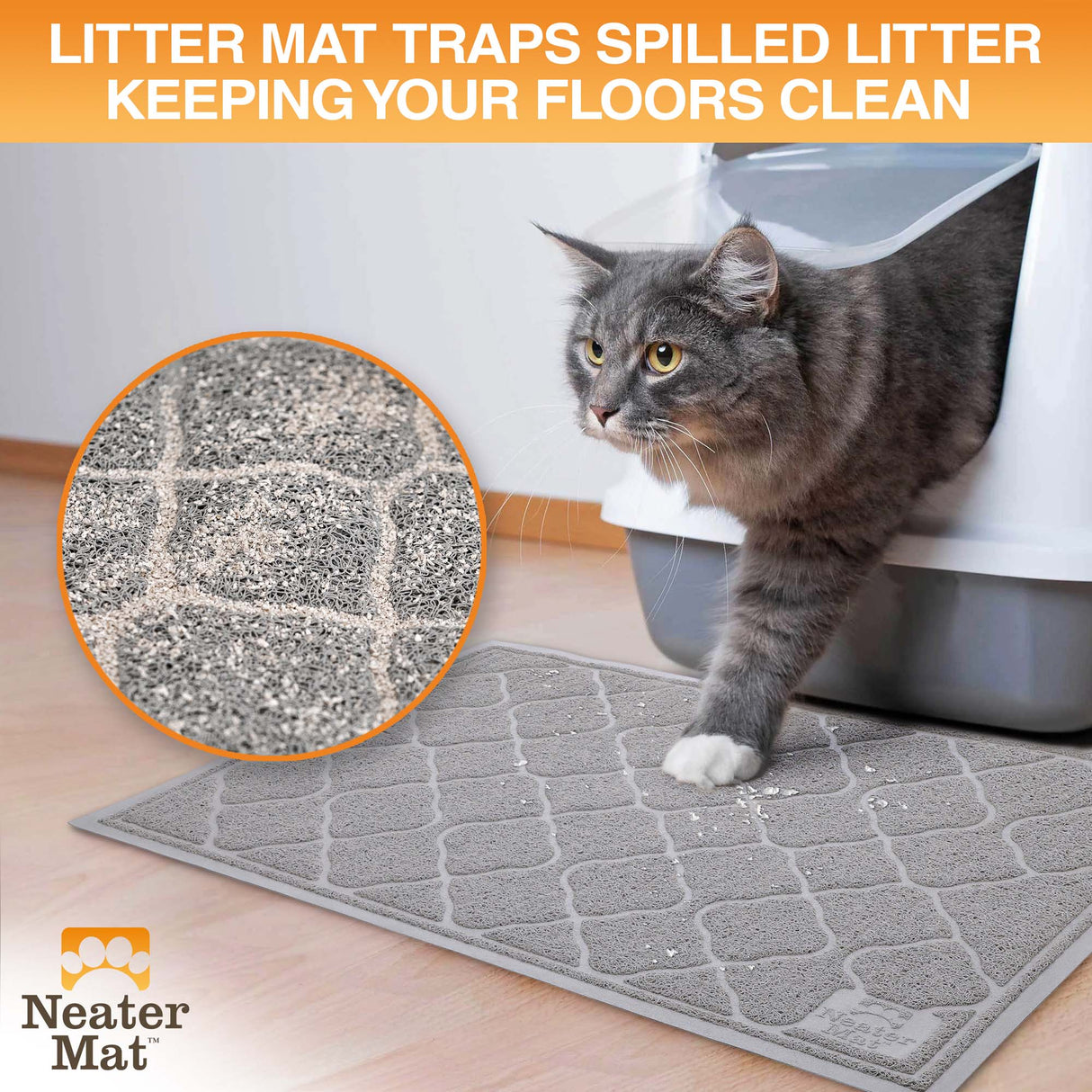 Cat exiting a litter box and stepping on a Neater Mat Litter Mat which traps the litter on their paws.