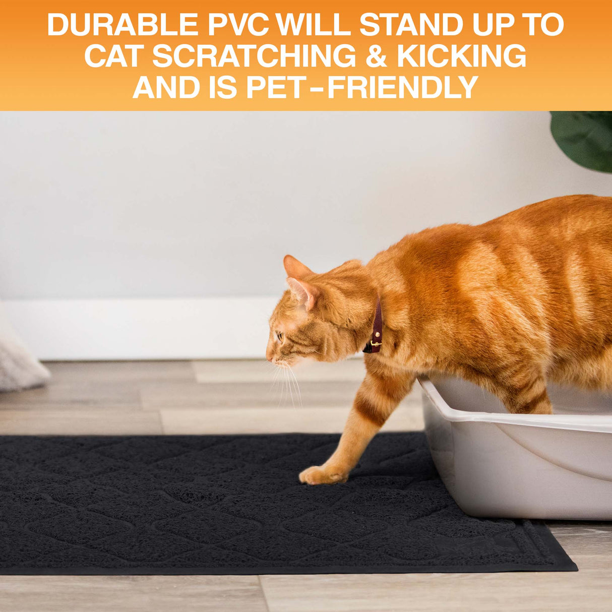 Cat using a litter box on a black mat with text about durable PVC material