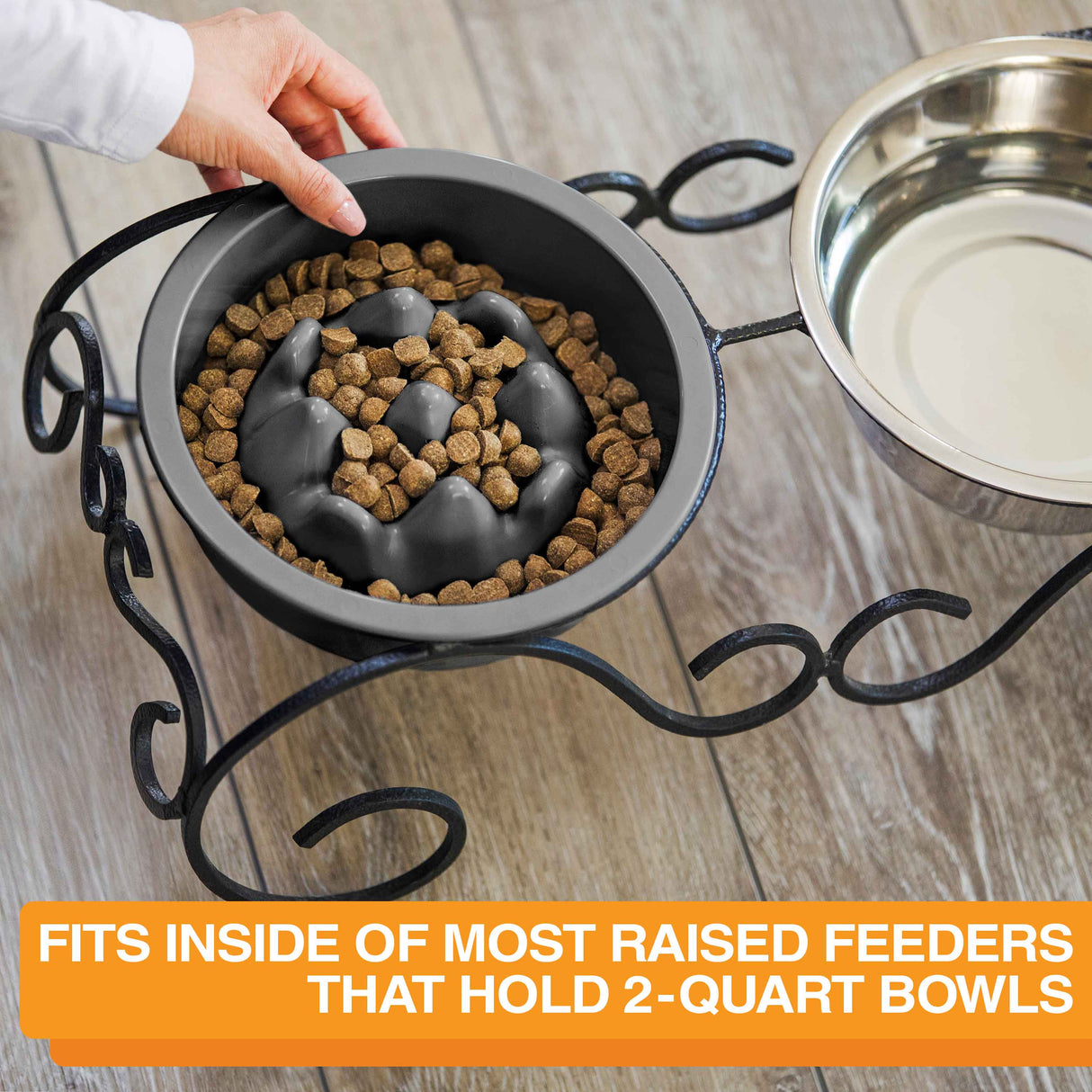 Woman placing The Niner inside the Wrought Iron feeder with text that says the bowl can fit into most raised feeders that hold 2-quart bowls.