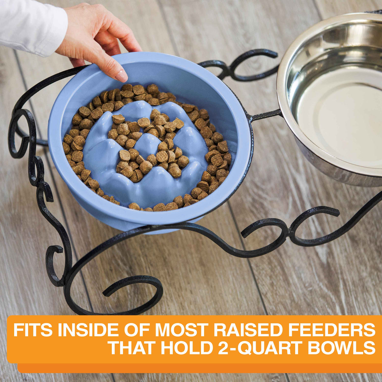 Woman placing The Niner inside the Wrought Iron feeder with text that says the bowl can fit into most raised feeders that hold 2-quart bowls.
