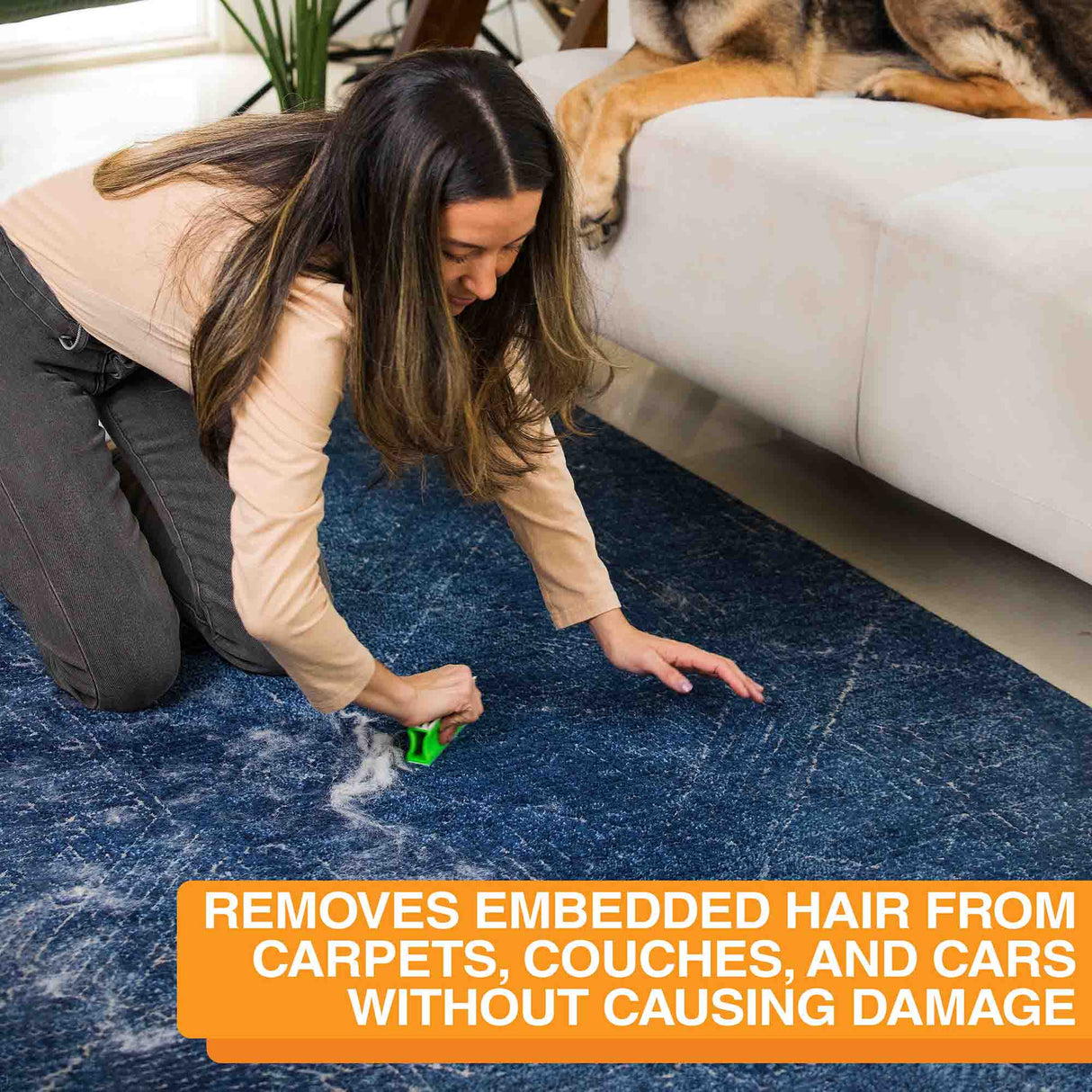 A woman using a FurDozer on the carpet, pulling up a pile of hair. Text on screen reads: Removes embedded hair from carpets, couches, and cars without causing damage.