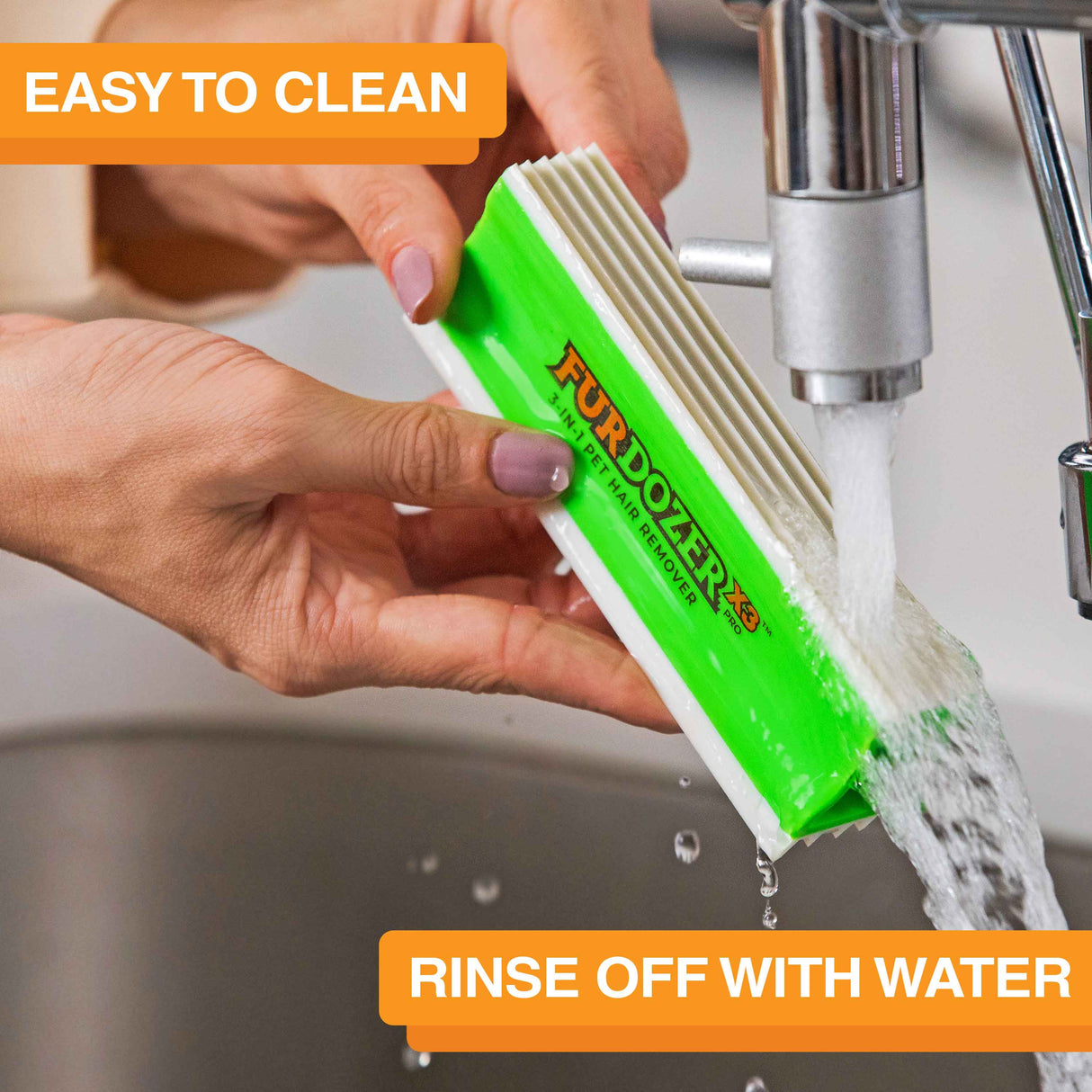 FurDozer is being cleaned in a sink with water coming out of the spicket. Text on screen reads: Easy to clean. Rinse off with water.