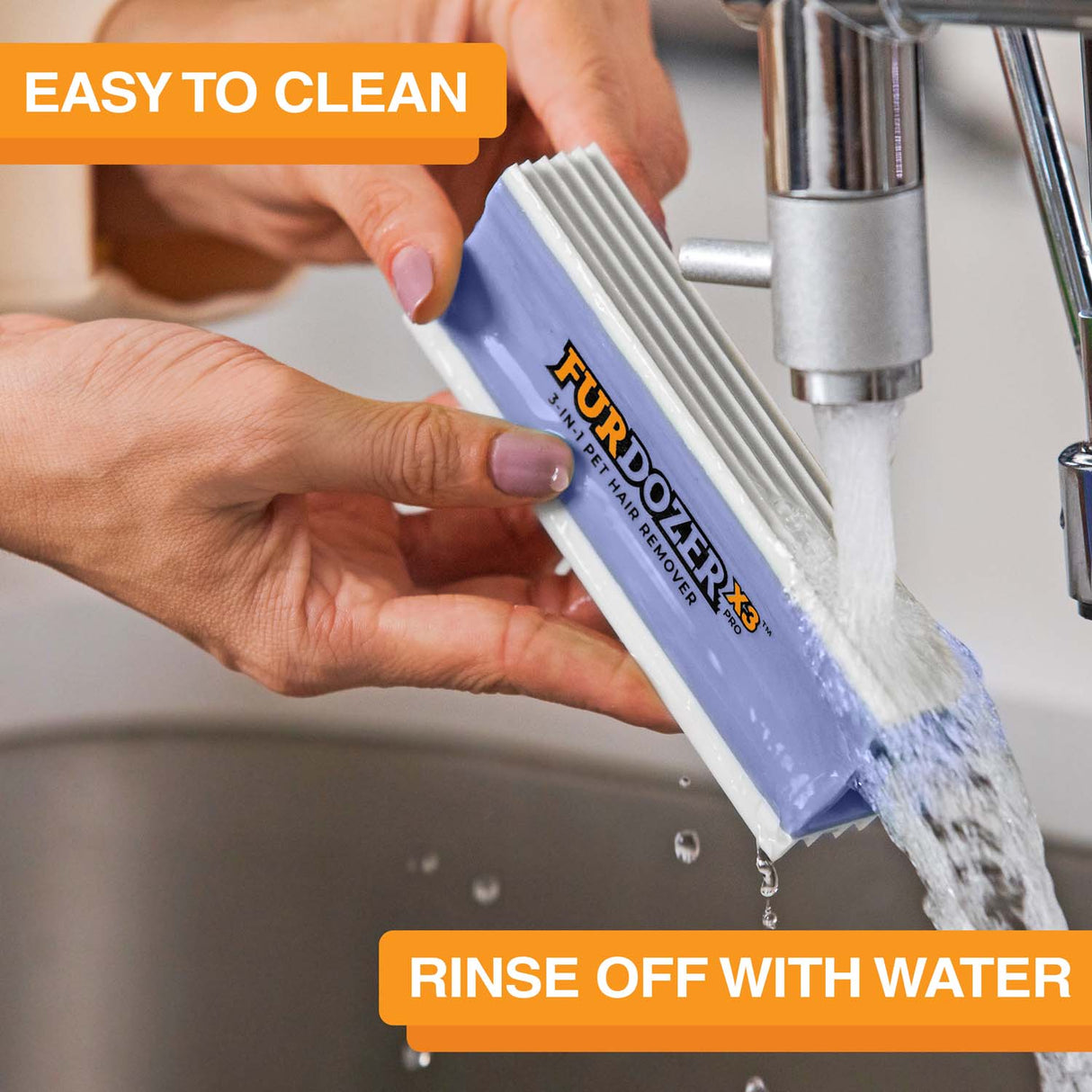 FurDozer is being cleaned in a sink with water coming out of the spicket. Text on screen reads: Easy to clean. Rinse off with water.