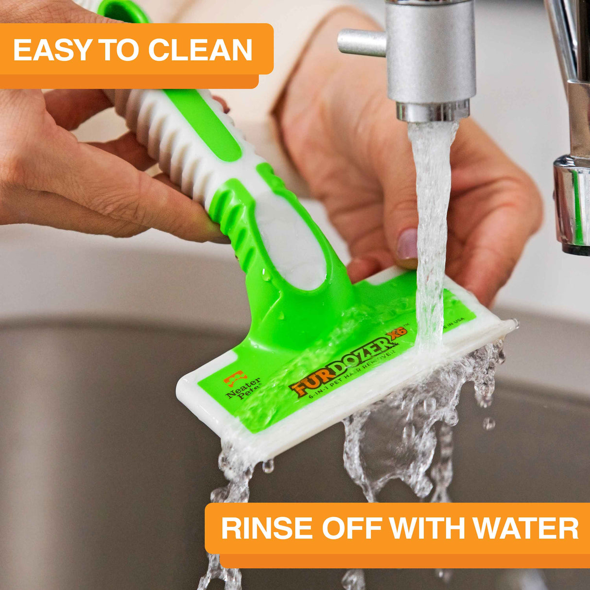 FurDozer is being cleaned in a sink with water coming out of the spicket. Text on screen reads: Easy to clean. Rinse off with water.