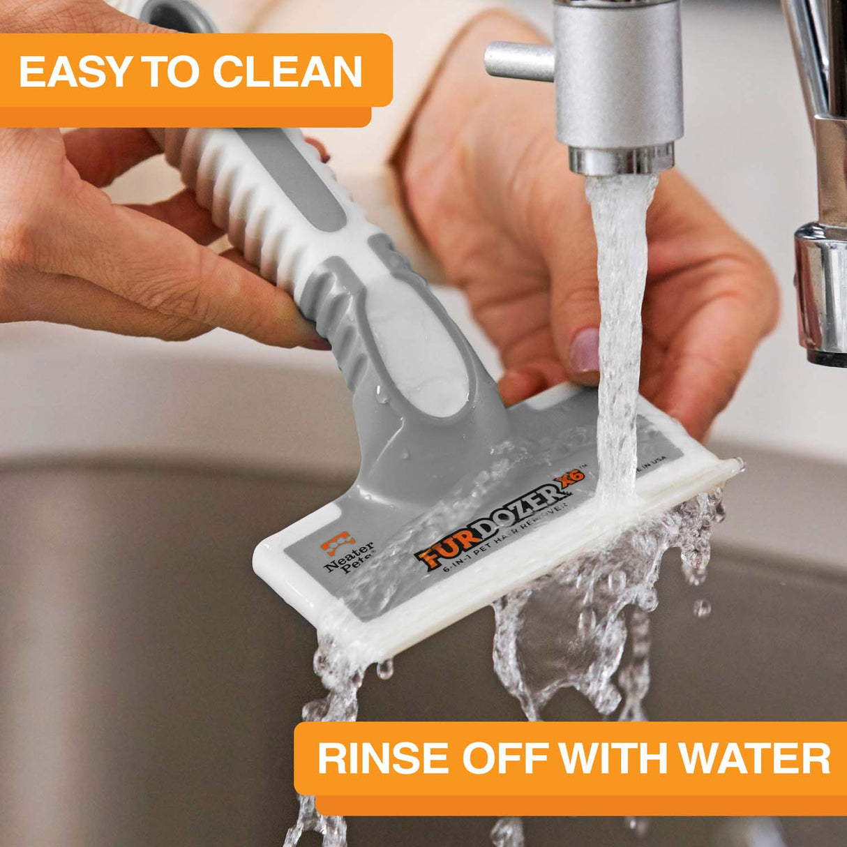 FurDozer is being cleaned in a sink with water coming out of the spicket. Text on screen reads: Easy to clean. Rinse off with water.