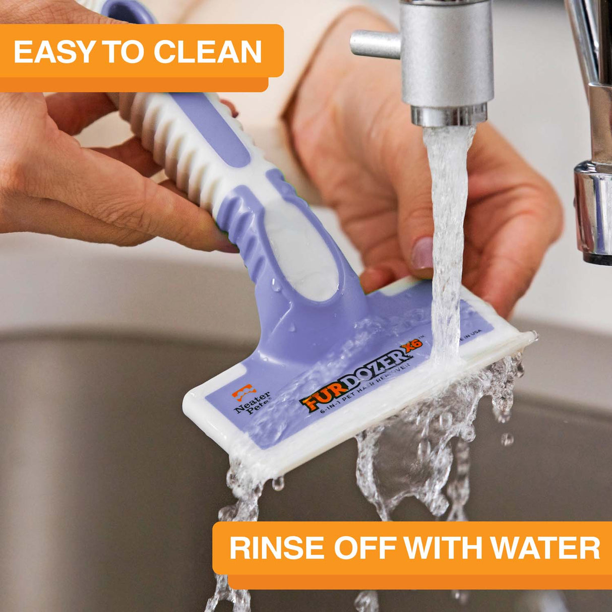 FurDozer is being cleaned in a sink with water coming out of the spicket. Text on screen reads: Easy to clean. Rinse off with water.