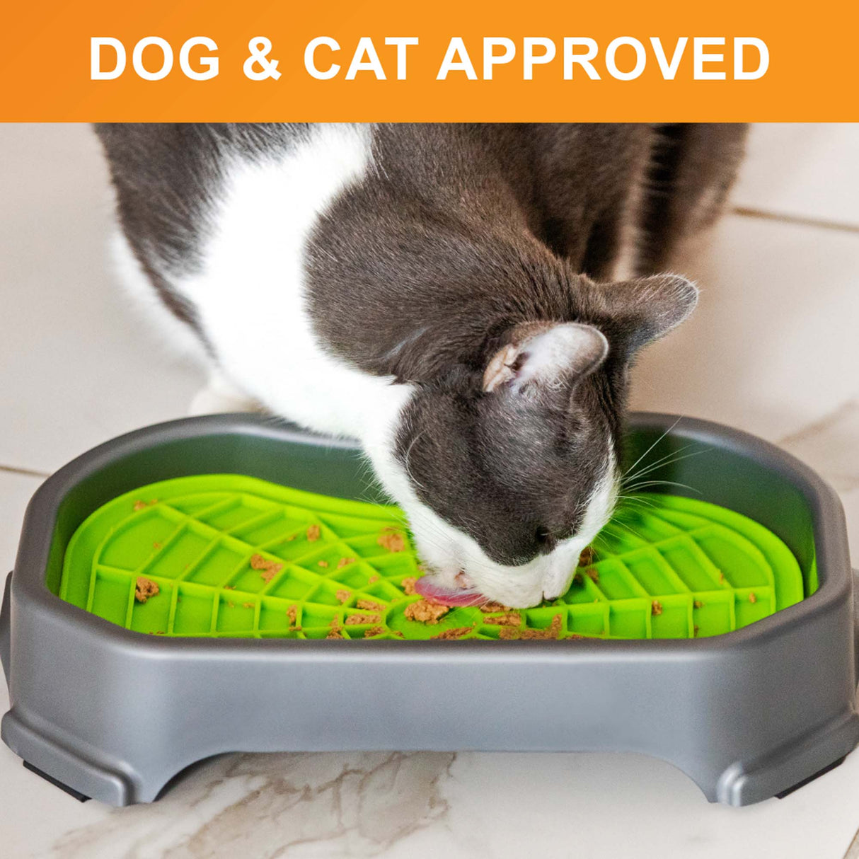 Cat licking food out of the Neat-Lik Mat Slow Feed Licking Mat with the base with text that says "Dog and cat approved."