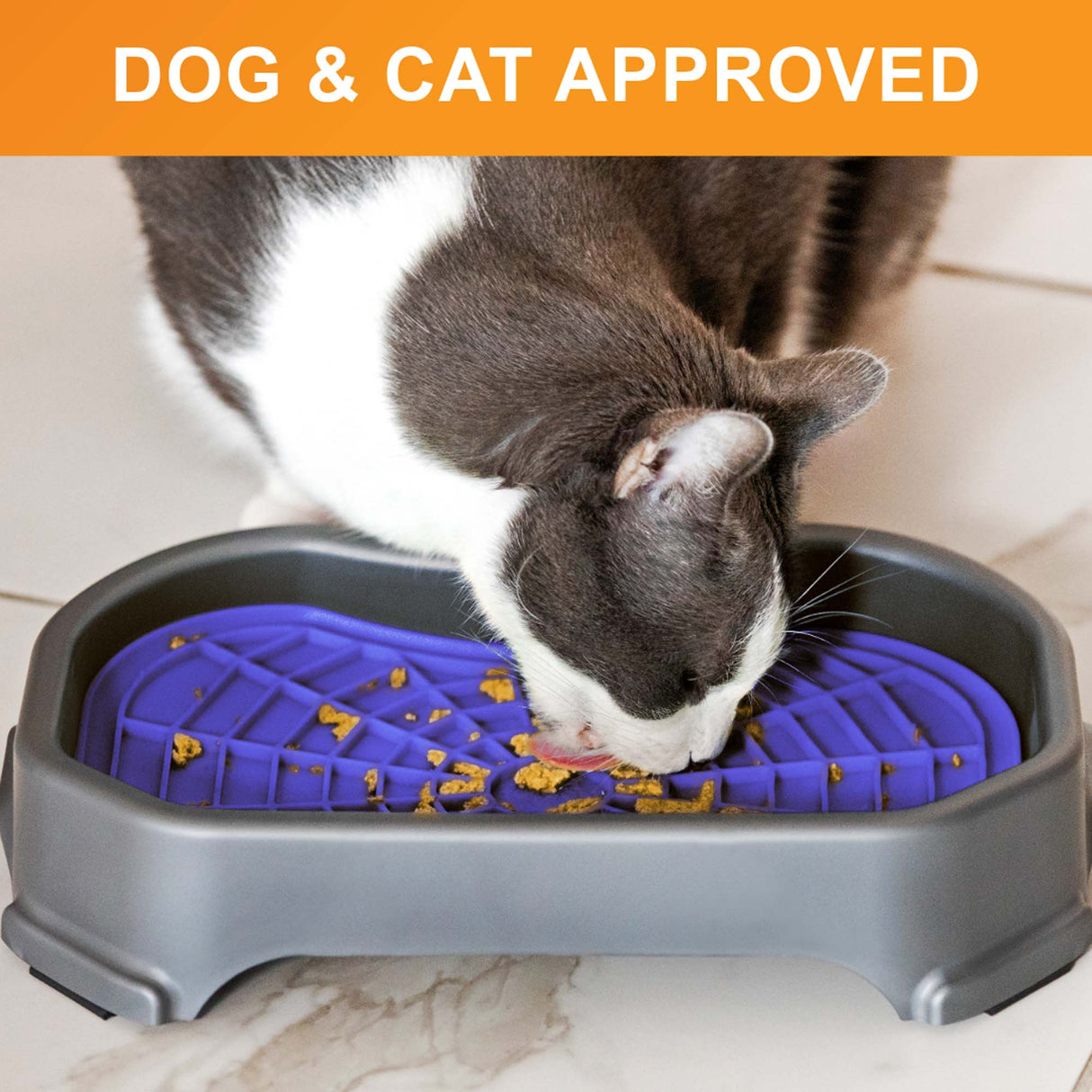 Cat licking food out of the Neat-Lik Mat Slow Feed Licking Mat with the base with text that says "Dog and cat approved."