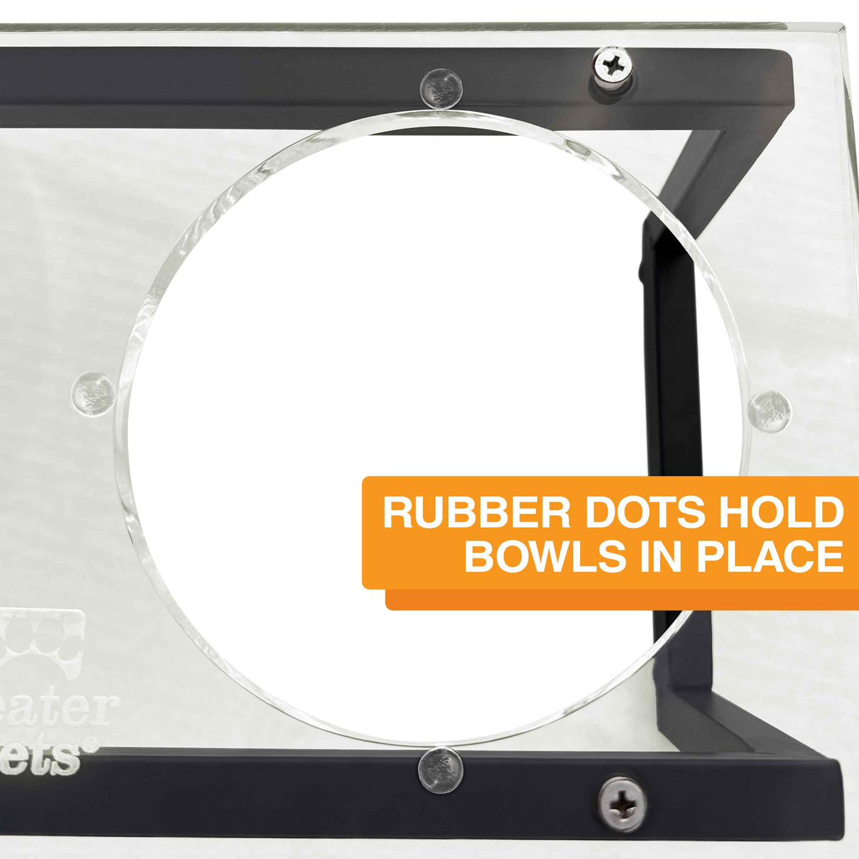 A close-up picture of rubber dots around the bowl hole. Text on screen reads: Rubber dots hold bowls in place.