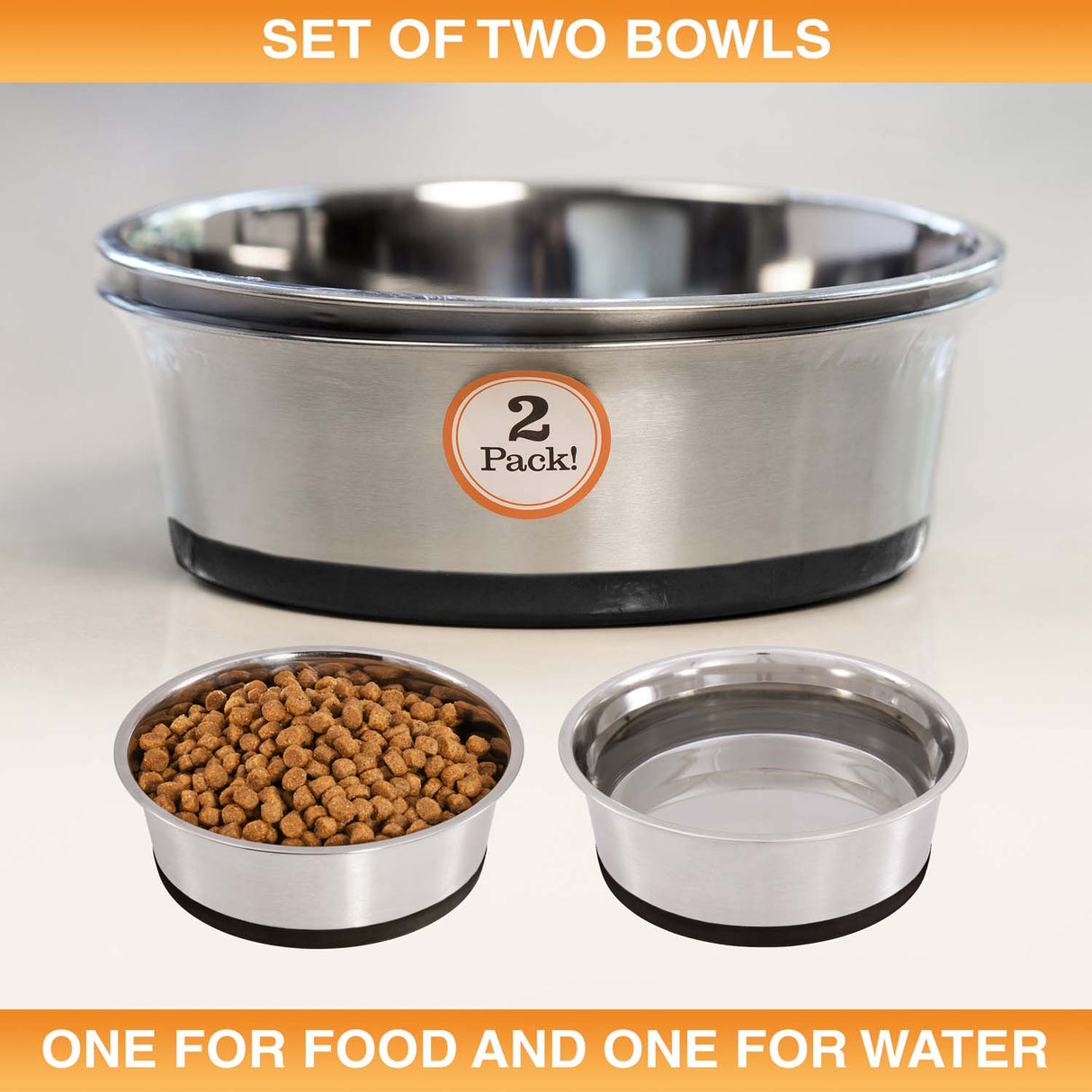Set of two stainless steel bowls for pet food and water on a light background