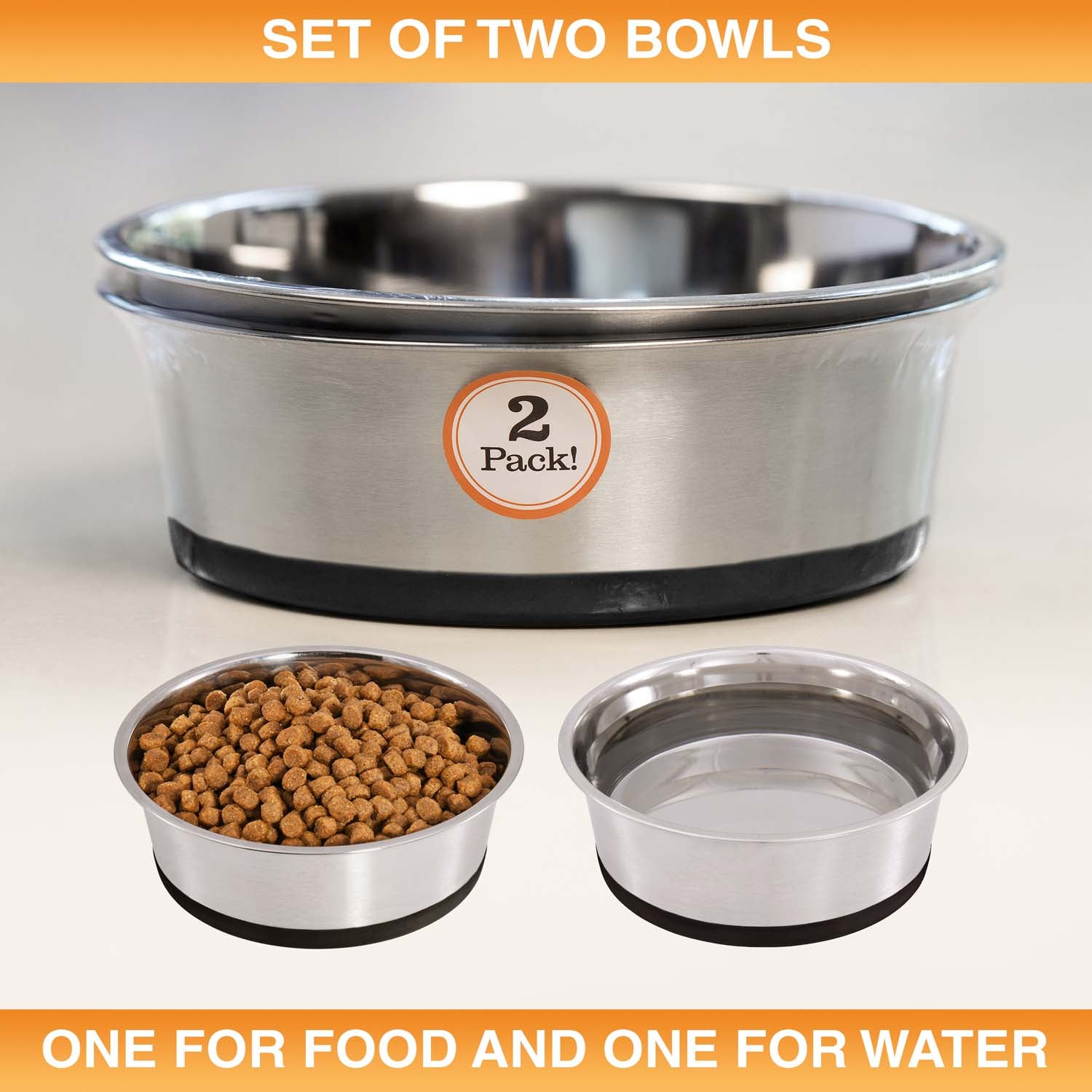 Set of two stainless steel bowls for food and water on a white background