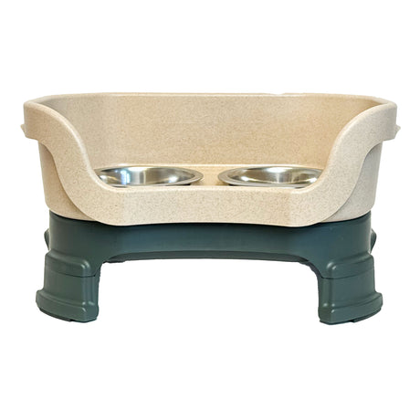 Neater Feeder with Leg Extensions Small Size in Hunter Green and Stone with two stainless steel bowls against a white background.