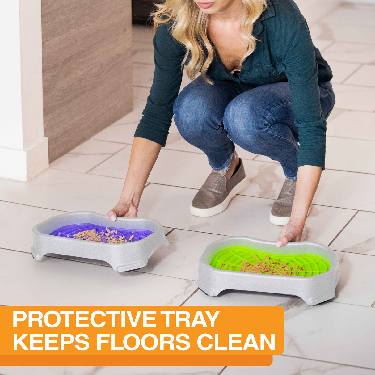 Women placing the Neat-Lik Mats on the ground inside with the protective tray