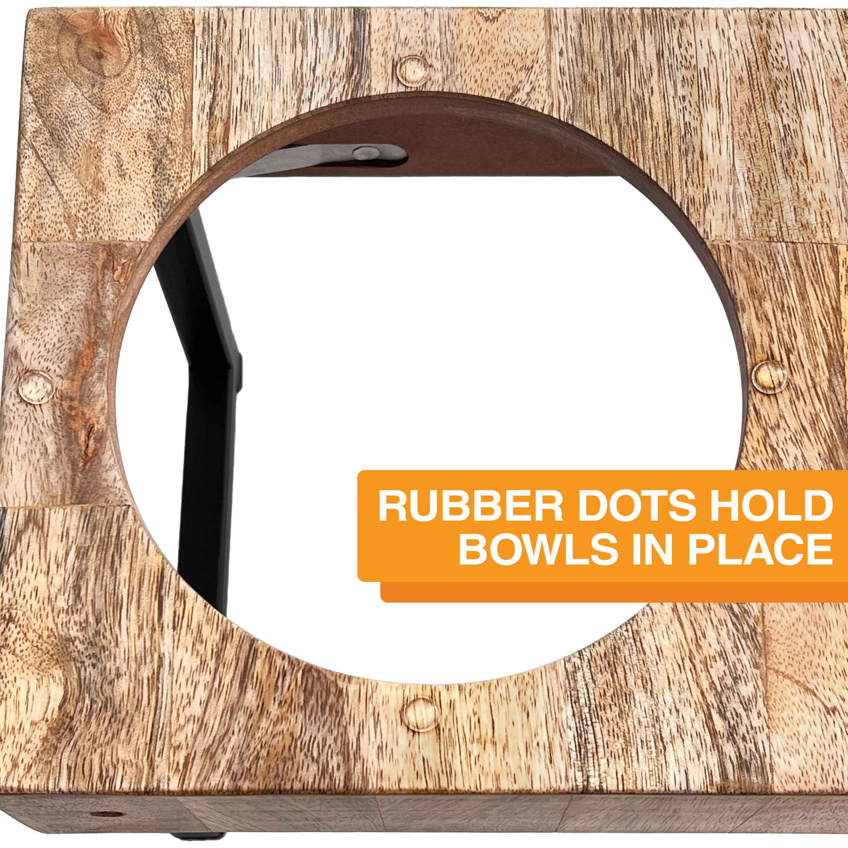 A close-up picture of rubber dots around the bowl hole. Text on screen reads: Rubber dots hold bowls in place.