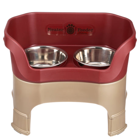 Neater Feeder Deluxe large with leg extensions in Cranberry with two stainless steel bowls against a white background.