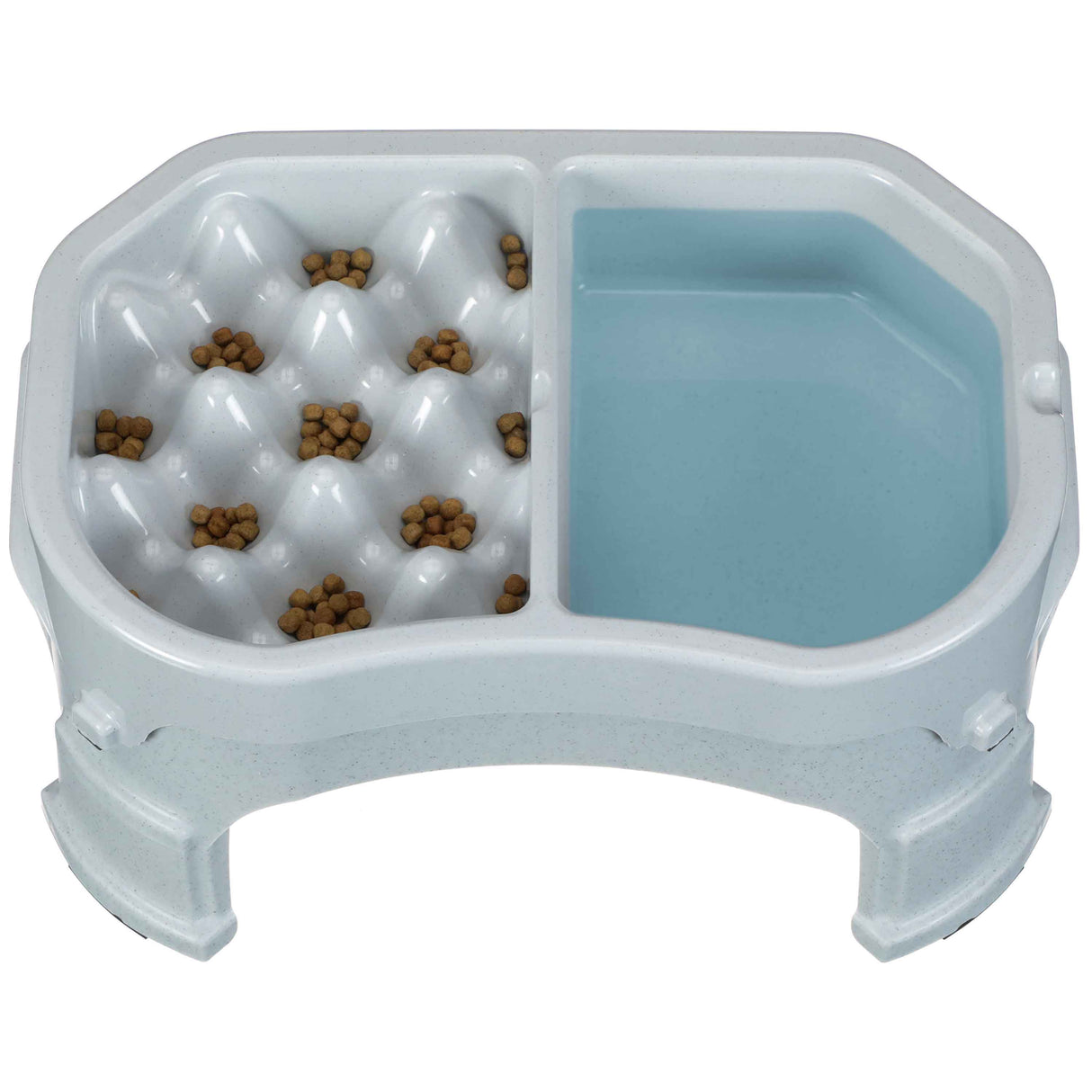 Neater Slow Feeder Double Diner raised in Vanilla Bean with kibble and water inside the feeder against a white background.