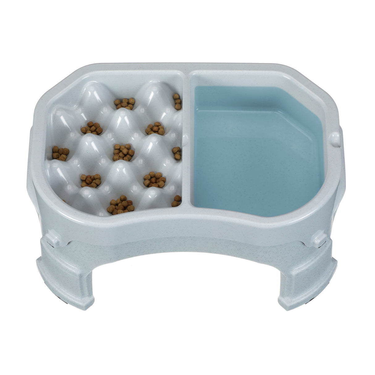 Neater Slow Feeder Double Diner raised in Vanilla Bean with kibble and water inside the feeder against a white background.