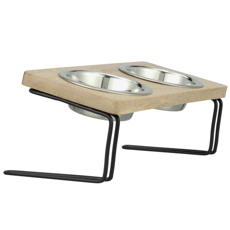 Elevated and angled feeder with stainless steel bowls side view on a white background.
