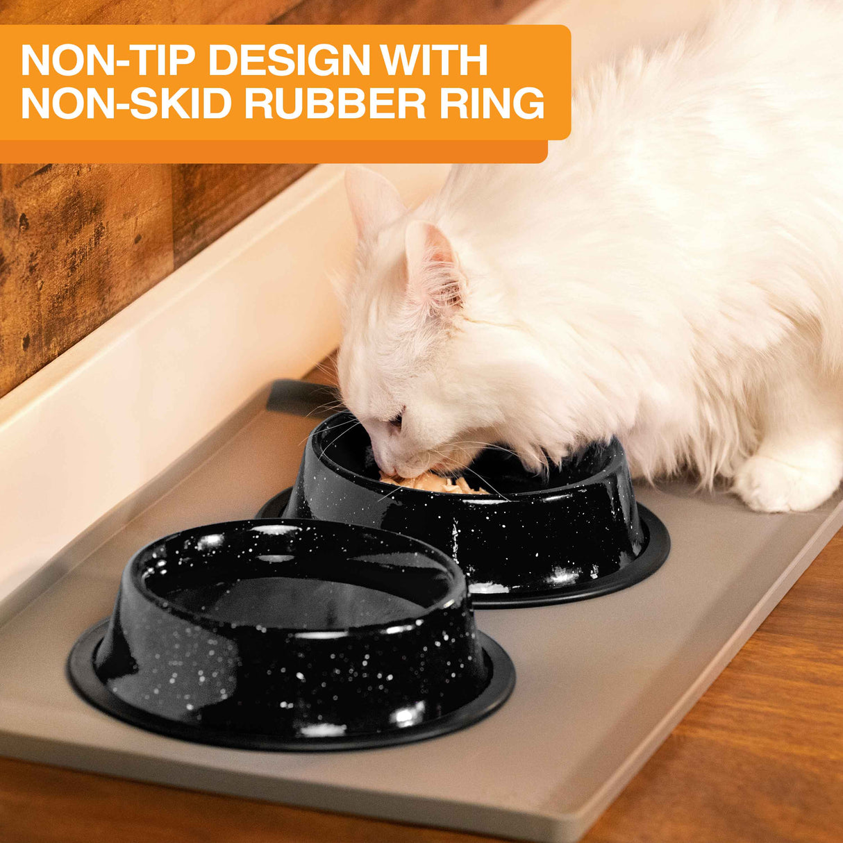 Image of a cat eating from the camping bowls inside on a mat. Text on screen reads: Non-tip design with non-skid rubber ring.