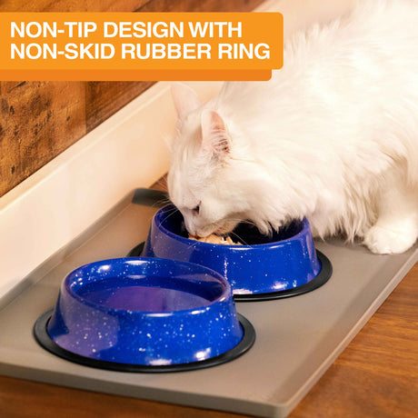 Image of a cat eating from the camping bowls inside on a mat. Text on screen reads: Non-tip design with non-skid rubber ring.