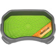 The green Neat-Lik Mat inside the grey protective tray on a white background.