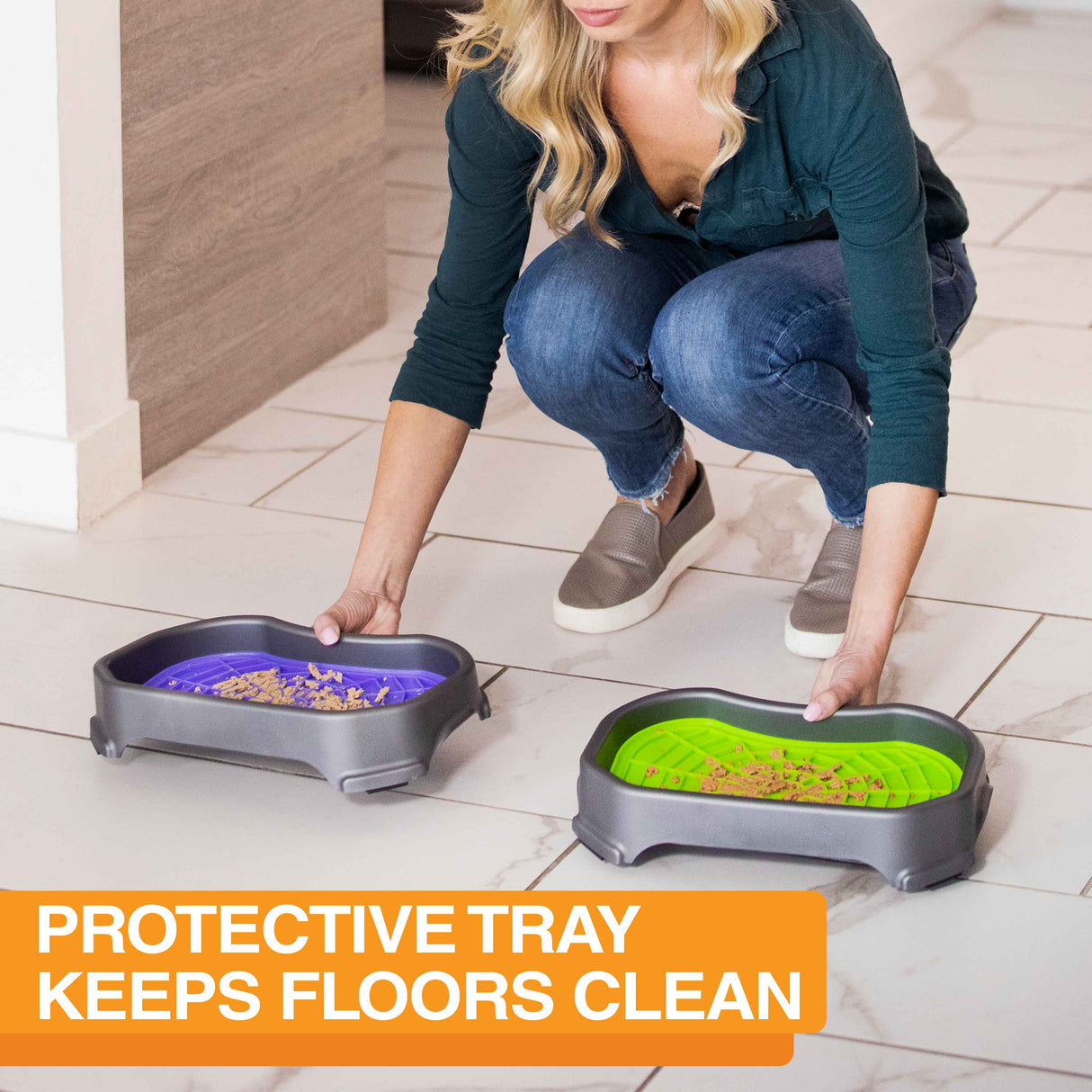 Women placing the Neat-Lik Mats on the ground inside with the protective tray