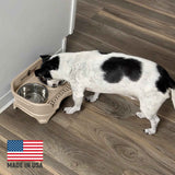 Small dog eating from Almond Express - Made in the USA