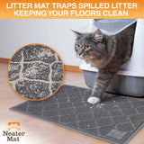 Cat exiting a litter box and stepping on a Neater Mat Litter Mat which traps the litter on their paws.