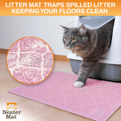 Cat exiting a litter box and stepping on a Neater Mat Litter Mat which traps the litter on their paws.