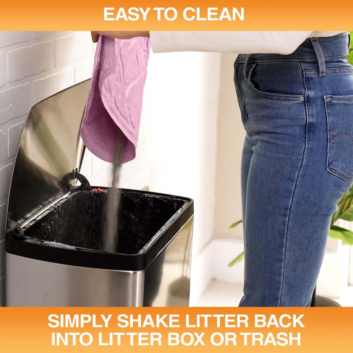 Woman pouring litter caught by the mat into a trash can