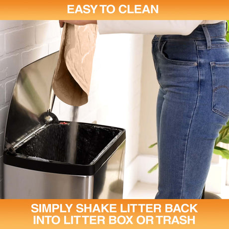 Woman pouring litter caught by the mat into a trash can