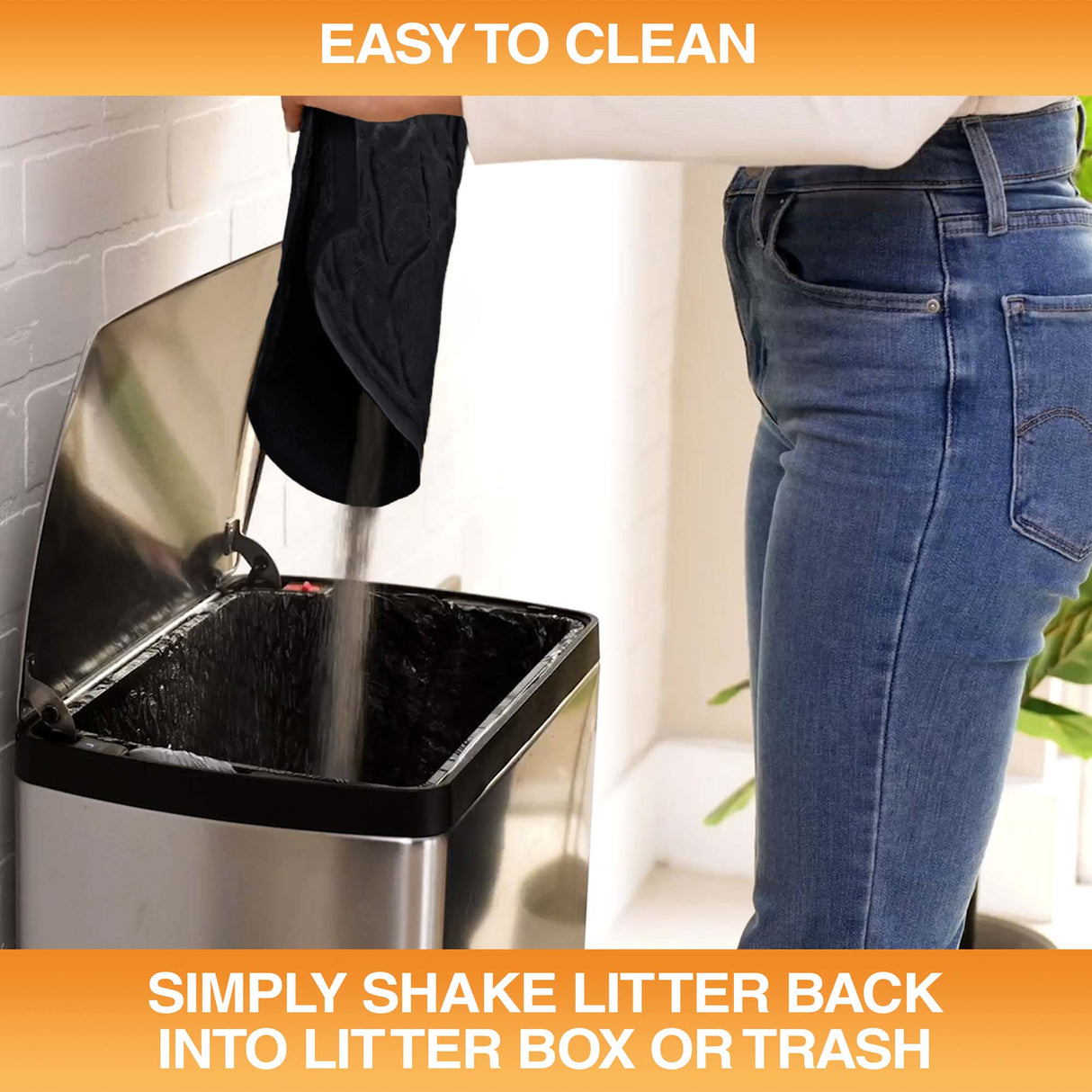 Woman pouring litter caught by the mat into a trash can