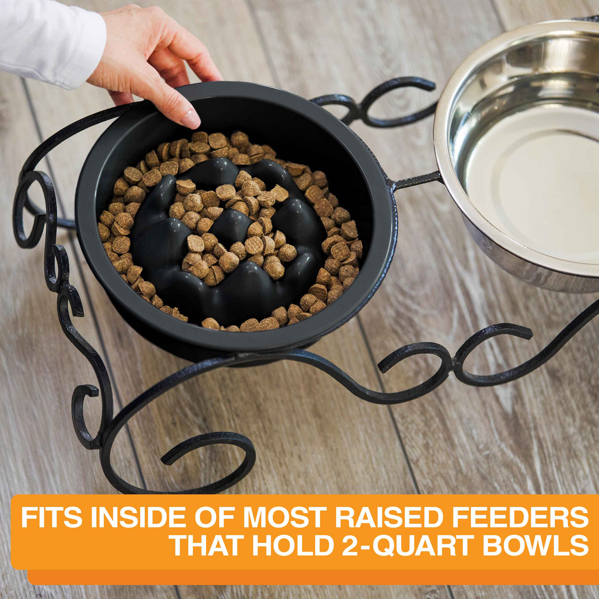 Woman placing The Niner inside the Wrought Iron feeder with text that says the bowl can fit into most raised feeders that hold 2-quart bowls.
