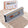 FurDozer X4 Pet Hair Remover and Lint Remover tool shown in front of its retail box on a beige shag rug with a streak of clean carpet under the FurDozer. The FurDozer is a gray color.