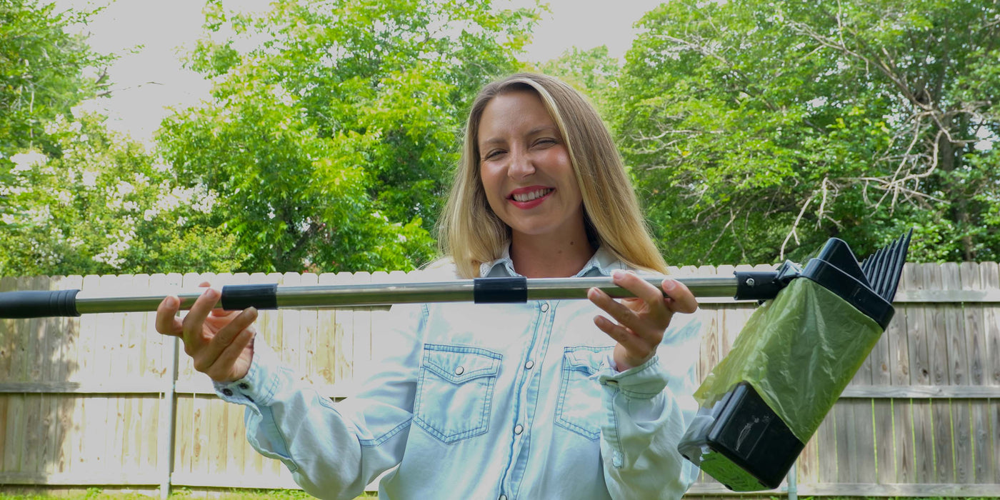A woman holds the new 31 inch pole version of the Lift N' Bag