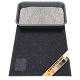 Black cat litter mat with a litter box on top, featuring a brand label with color swatches (pink, beige, gray, charcoal gray, and black).