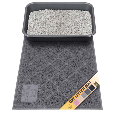 Charcoal cat litter mat with a litter box on top, featuring a brand label with color swatches (pink, beige, gray, charcoal gray, and black).