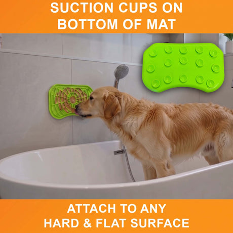 Suction cups on the bottom of the green Neat-Lik Express licking mat attach it to any hard, flat surface, here a bathtub wall for a golden retriever