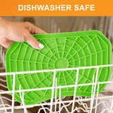 Dishwasher safe: a hand places the green Neat-Lik Express licking mat on the top rack of a dishwasher