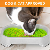 Cat licking food out of the Neat-Lik Mat Slow Feed Licking Mat with the base with text that says "Dog and cat approved."