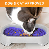 Cat licking food out of the Neat-Lik Mat Slow Feed Licking Mat with the base with text that says "Dog and cat approved."