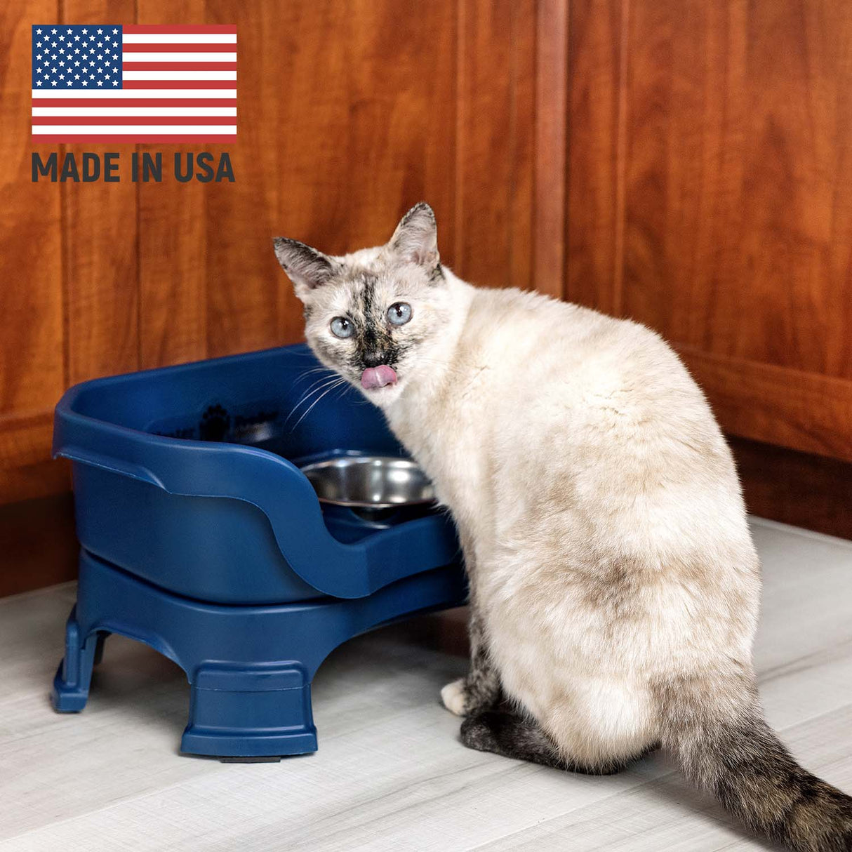 Cat eating from Dark Blue Neater Feeder Deluxe - Made in the USA