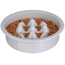 The Niner Slow Feed Bowl with kibble inside the feeder against a white background.