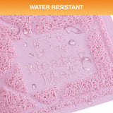 Water-resistant mat with 'Neater Mat' branding and water droplets on a textured surface.