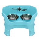 Deluxe Medium Neater Feeder with leg extensions in Aqua with two stainless steel bowls against a white background.