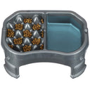 Raised Neater Slow Feeder Double Diner with kibble and water inside the feeder against a white background.