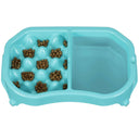 Top view of the Neater Slow Feeder Double Diner with kibble and water inside the feeder against a white background.