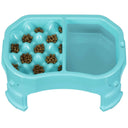 Raised Neater Slow Feeder Double Diner with kibble and water inside the feeder against a white background.